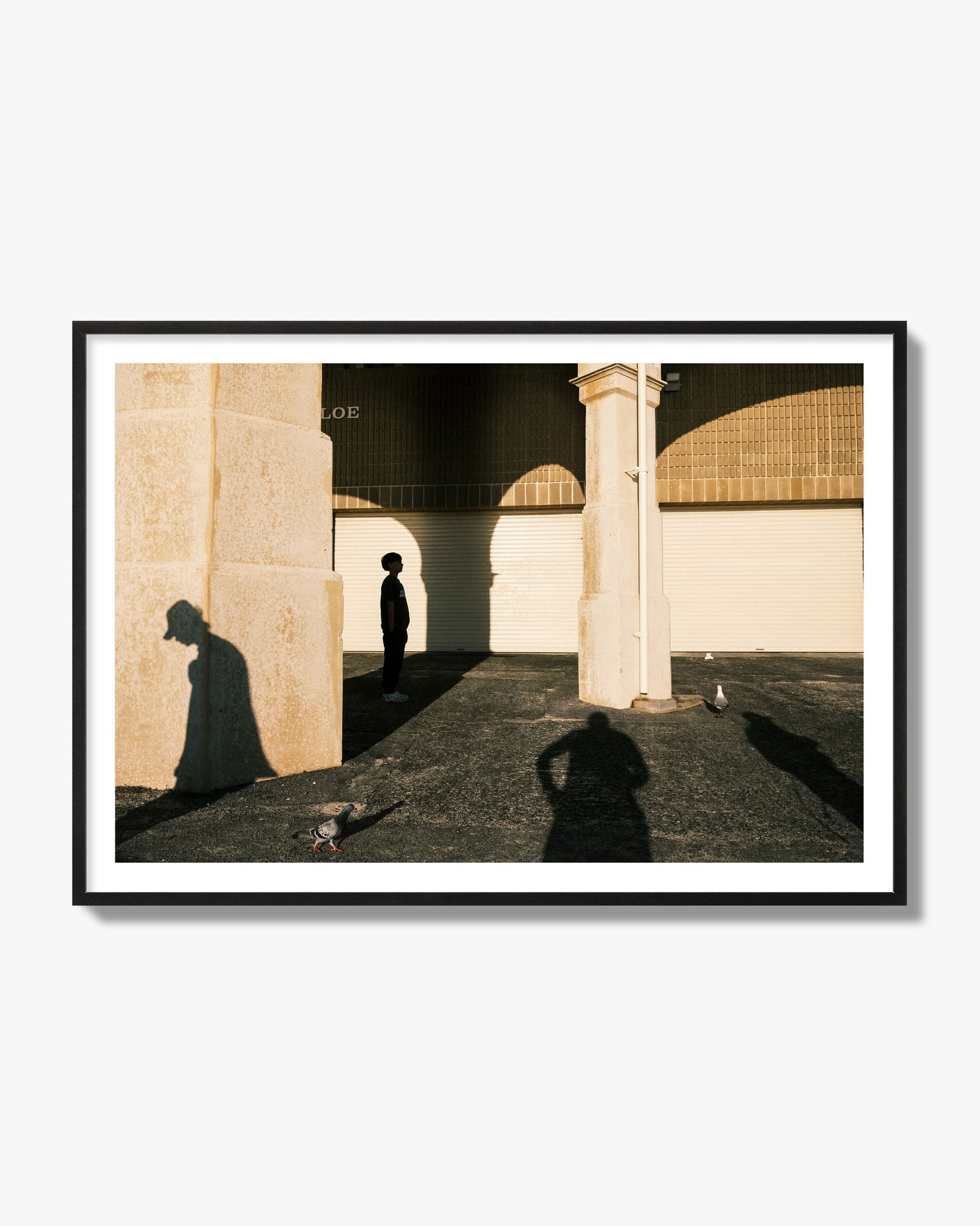 Fine art street photograph of shadows cast on the walls of the Indiana Tea House at Cottesloe Perth Western Australia. Archival pigment print, black frame.