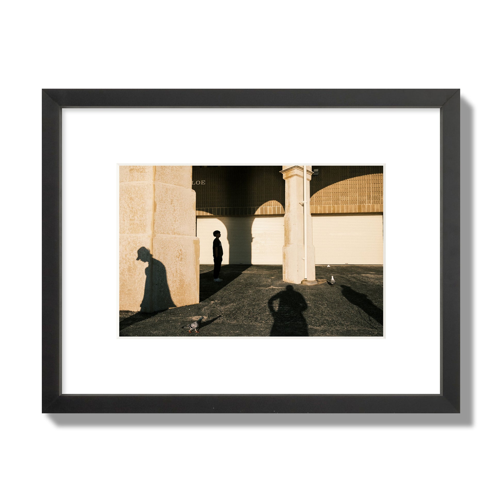 Fine art street photograph of shadows cast on the walls of the Indiana Tea House at Cottesloe Perth Western Australia. Archival pigment print, small size, black frame.