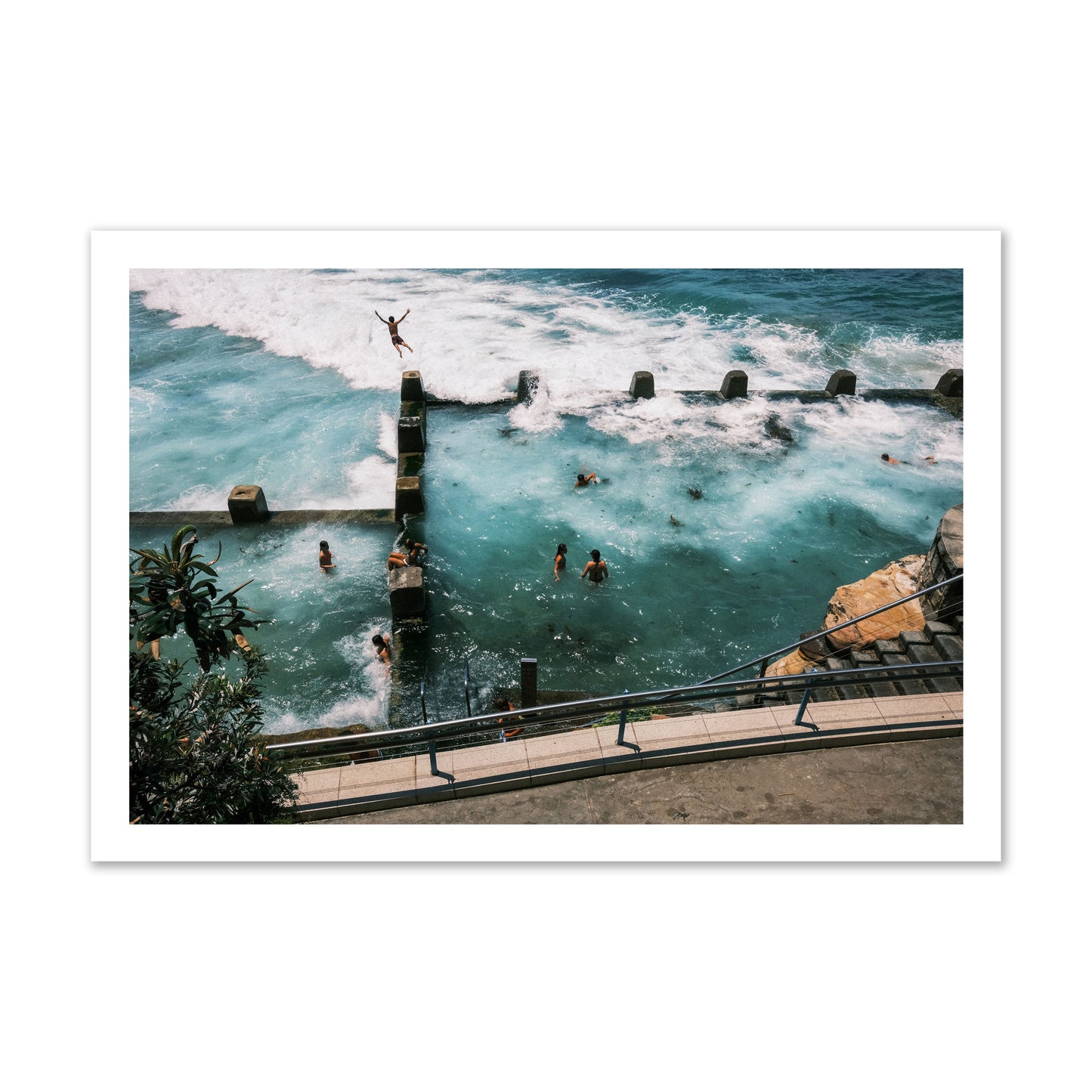 Fine art street photograph of a man jumping into the ocean. Archival pigment print, gallery size, print.