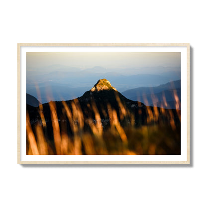 Fine art photo of a mountain peak at sunset. Archival pigment print, collector size, natural wood frame.