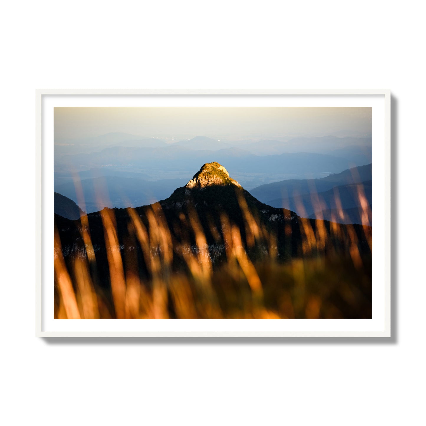 Fine art photo of a mountain peak at sunset. Archival pigment print, collector size, white frame.