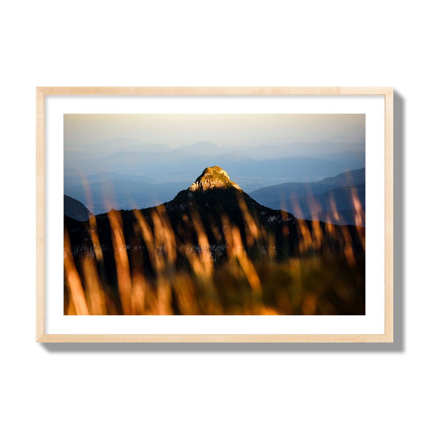 Fine art photo of a mountain peak at sunset. Archival pigment print, giant size, natural wood frame.