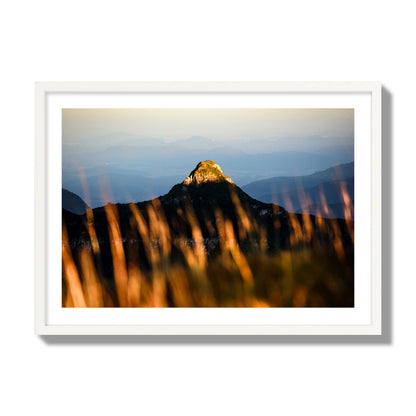 Fine art photo of a mountain peak at sunset. Archival pigment print, giant size, white frame.