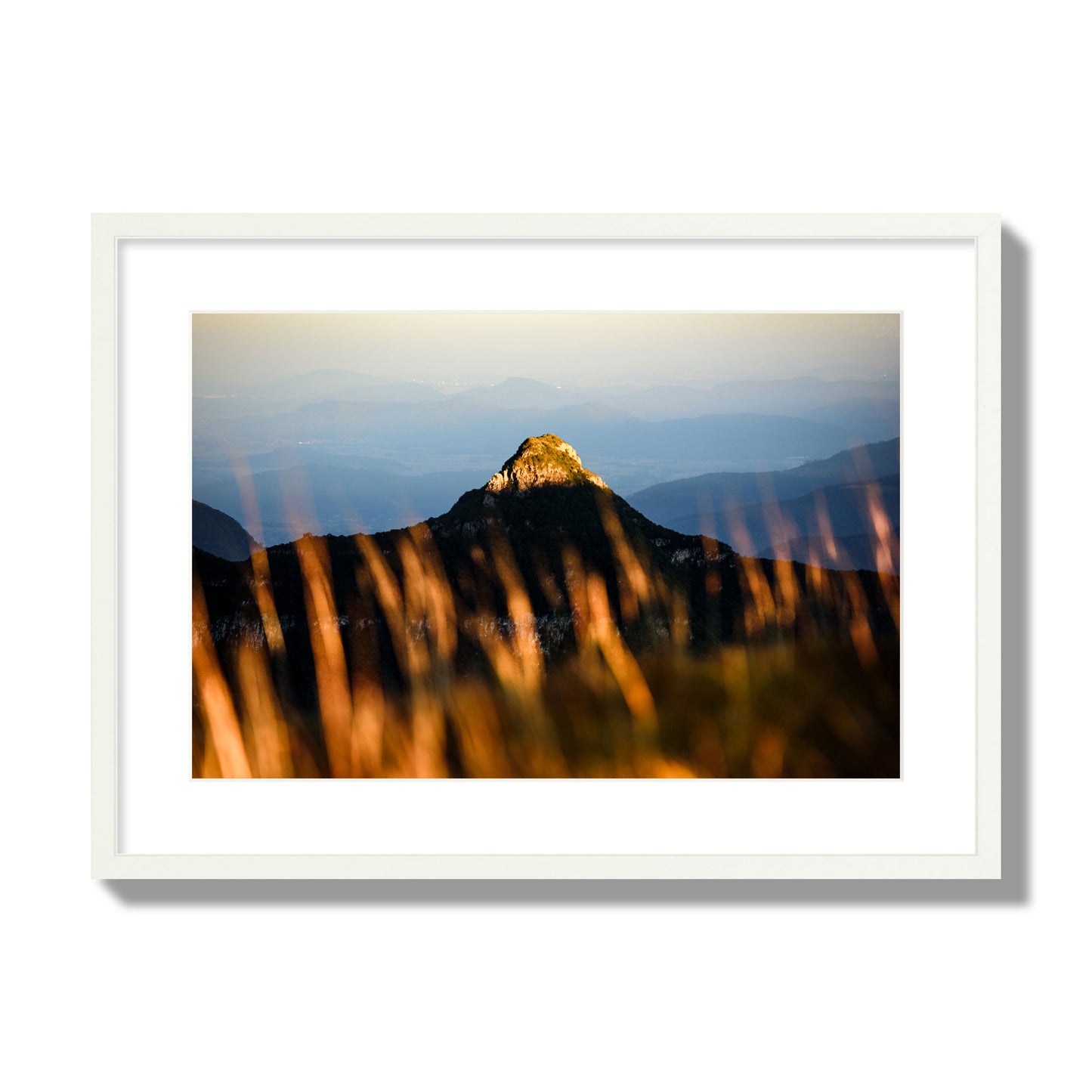 Fine art photo of a mountain peak at sunset. Archival pigment print, large size, white frame.