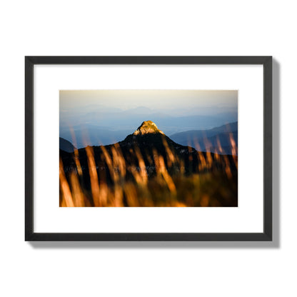 Fine art photo of a mountain peak at sunset. Archival pigment print, medium size, black frame.