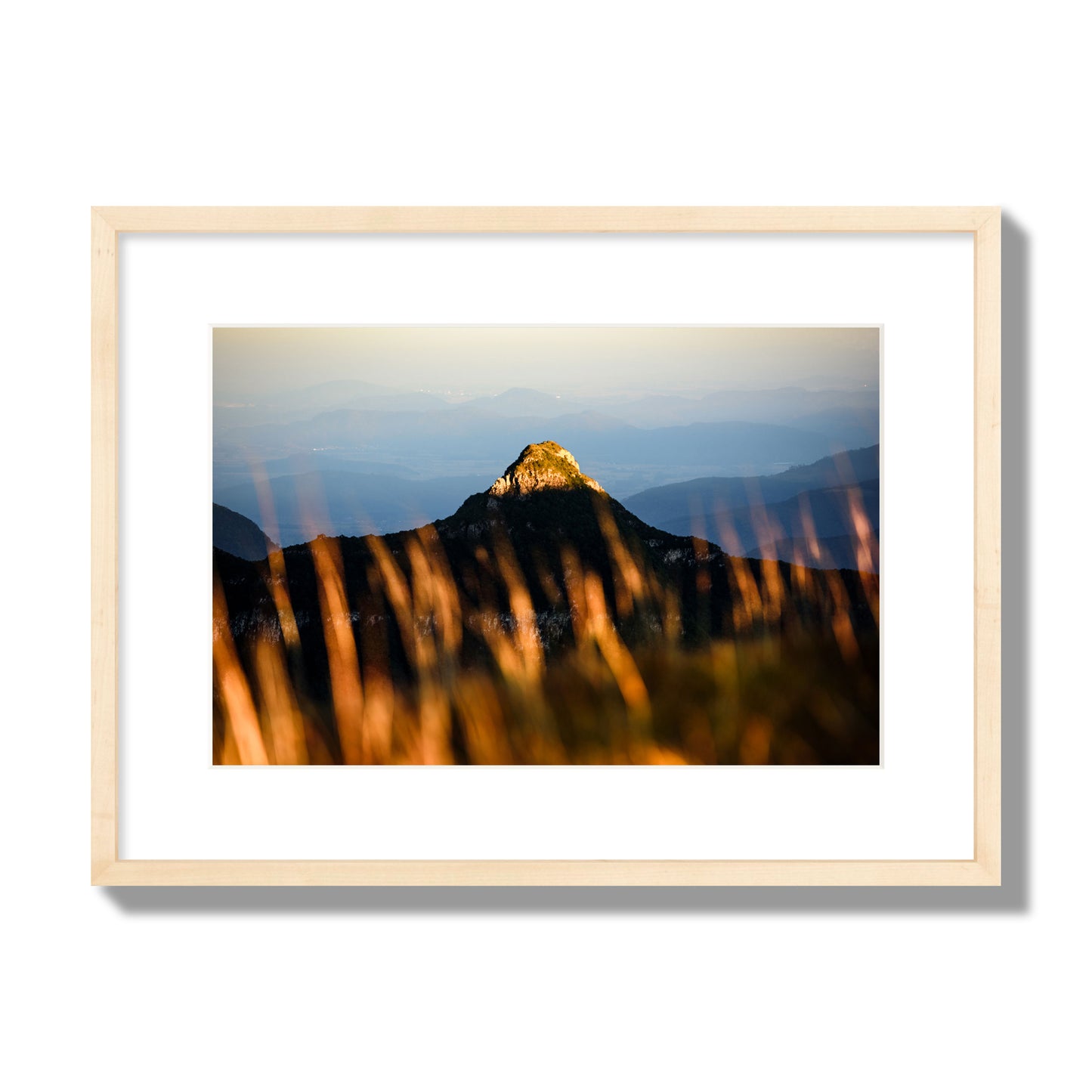 Fine art photo of a mountain peak at sunset. Archival pigment print, medium size, natural wood frame.