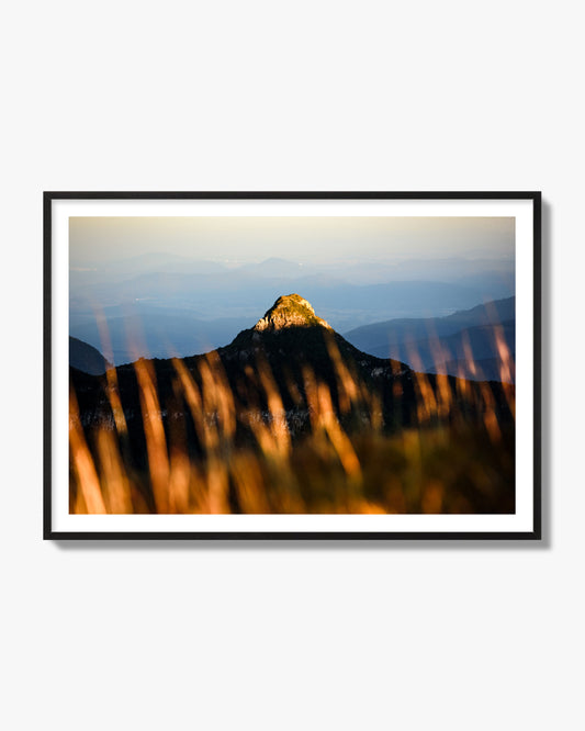 Fine art photo of a mountain peak at sunset. Archival pigment print, black frame.
