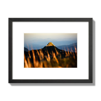 Fine art photo of a mountain peak at sunset. Archival pigment print, small size, black frame.