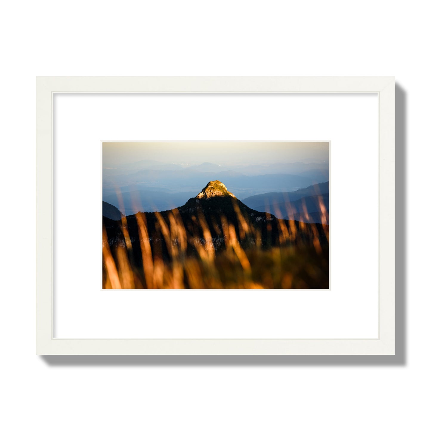 Fine art photo of a mountain peak at sunset. Archival pigment print, small size, white frame.