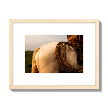 Fine art photo of a cowboy's lasso coiled across a horse's back. Archival pigment print, small size, natural wood frame.