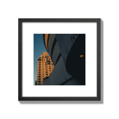 Fine art photograph of the Guggenheim Museum at dusk, archival pigment print, medium size, black frame.