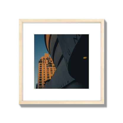 Fine art photograph of the Guggenheim Museum at dusk, archival pigment print, medium size, natural wood frame.