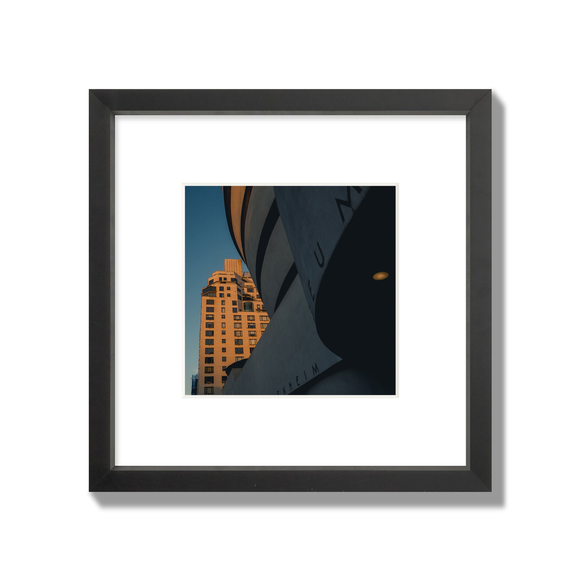 Fine art photograph of the Guggenheim Museum at dusk, archival pigment print, small size, black frame.