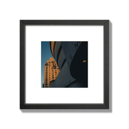 Fine art photograph of the Guggenheim Museum at dusk, archival pigment print, small size, black frame.