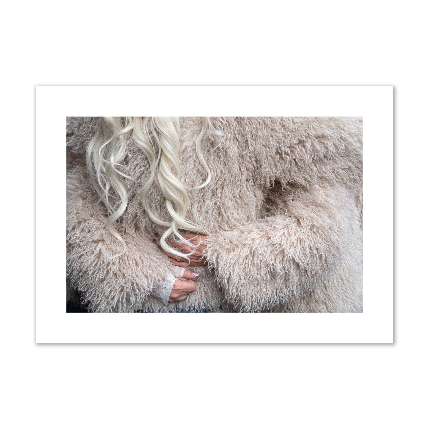 Fine art  street photograph of a woman wrapped in a huge furry coat. Archival pigment print, giant size, print.