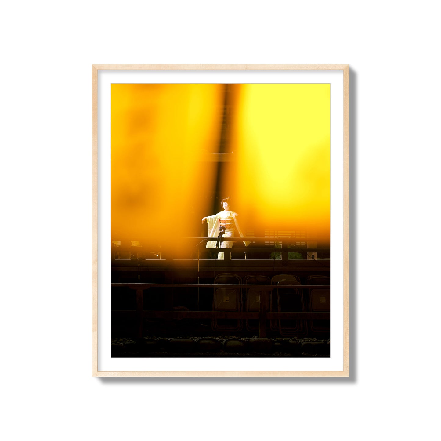 Fine art photograph of a geisha dancing, photographed through yellow lanterns, archival pigment print, collector size, natural wood frame.