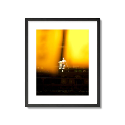 Fine art photograph of a geisha dancing, photographed through yellow lanterns, archival pigment print, large size, black frame.