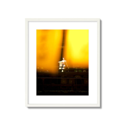 Fine art photograph of a geisha dancing, photographed through yellow lanterns, archival pigment print, large size, white frame.