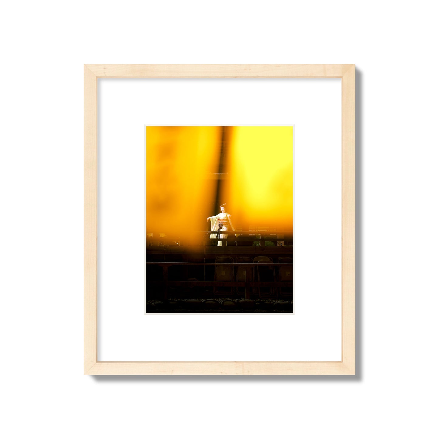 Fine art photograph of a geisha dancing, photographed through yellow lanterns, archival pigment print, small size, natural wood frame.