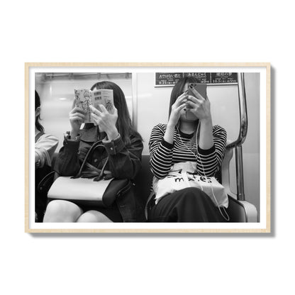 Black and white fine art photograph of two women on the Tokyo Metro, archival pigment print, gallery size, natural wood frame