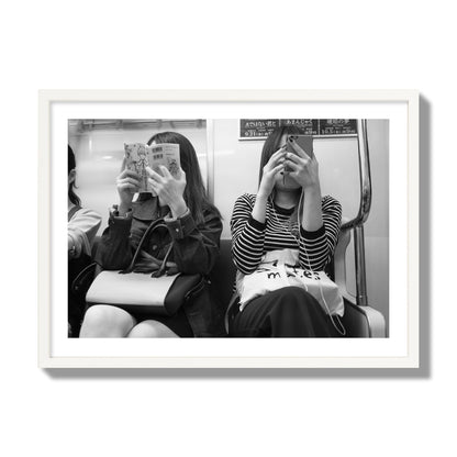 Black and white fine art photograph of two women on the Tokyo Metro, archival pigment print, giant size, white frame