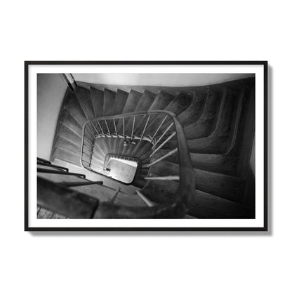 Fine art street photograph of a person walking down a staircase in Paris, France, archival pigment print, collector size, black frame