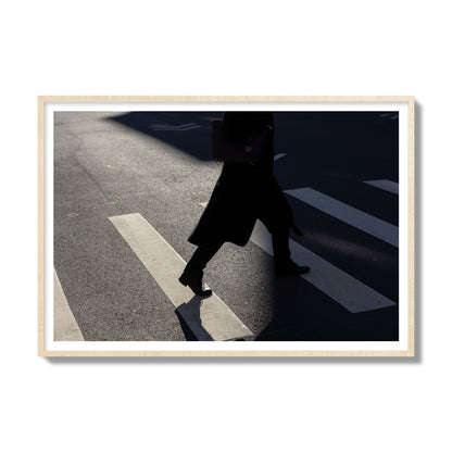 Fine art street photograph of a woman walking through a crosswalk in Soho New York, archival pigment print, gallery size, natural wood frame
