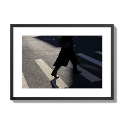 Fine art street photograph of a woman walking through a crosswalk in Soho New York, archival pigment print, large size, black frame