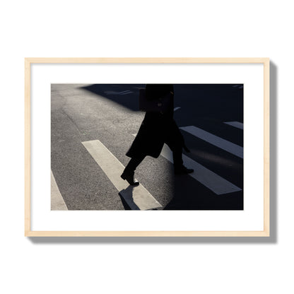 Fine art street photograph of a woman walking through a crosswalk in Soho New York, archival pigment print, large size, natural wood frame