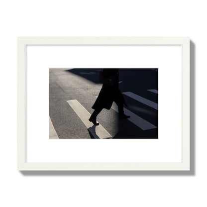 Fine art street photograph of a woman walking through a crosswalk in Soho New York, archival pigment print, small size, white frame