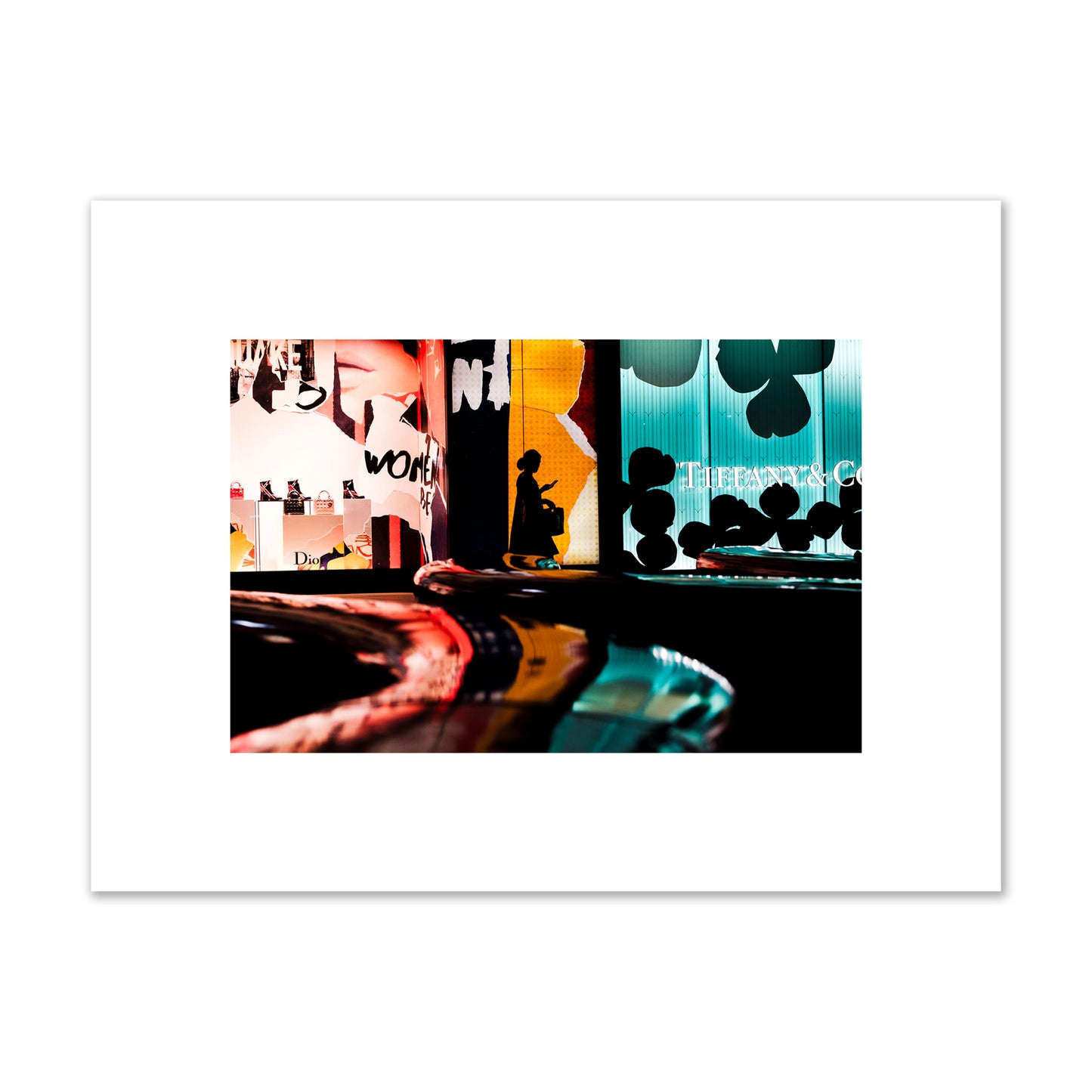 Fine art photograph of a woman’s silhouette walking past vibrant neon store signs, archival pigment print, small size, unframed.