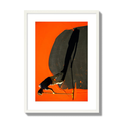Fine art street photograph, overhead view of a man painting an orange rooftop, captured in vivid detail. Archival pigment print, large size, white frame.