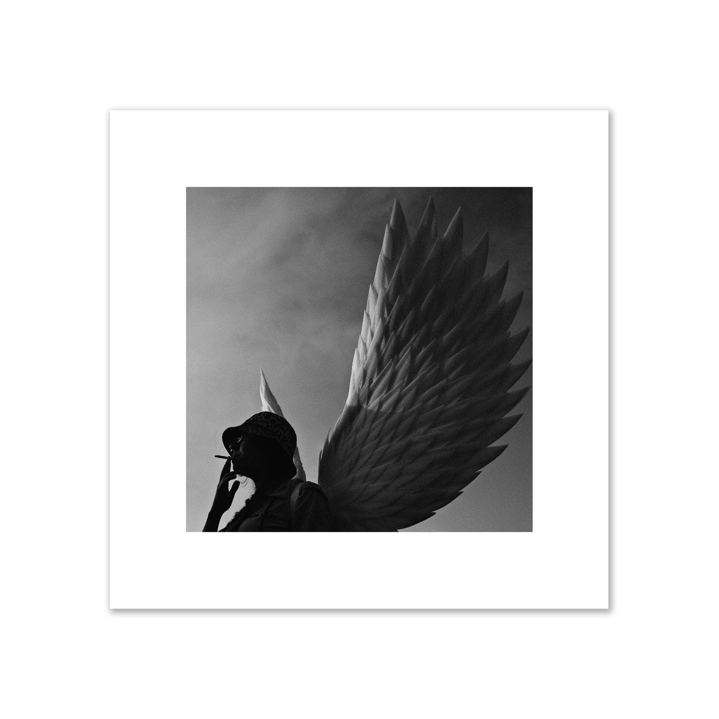 Fine art photography of a woman smoking in front of a winged statue, archival pigment print, large size, print.